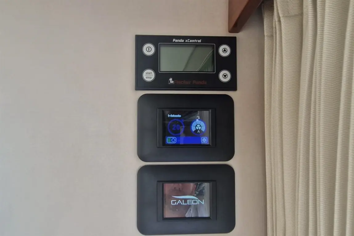 Control panel featuring Fischer Panda and Webasto displays with temperature settings and logo for Galeon.